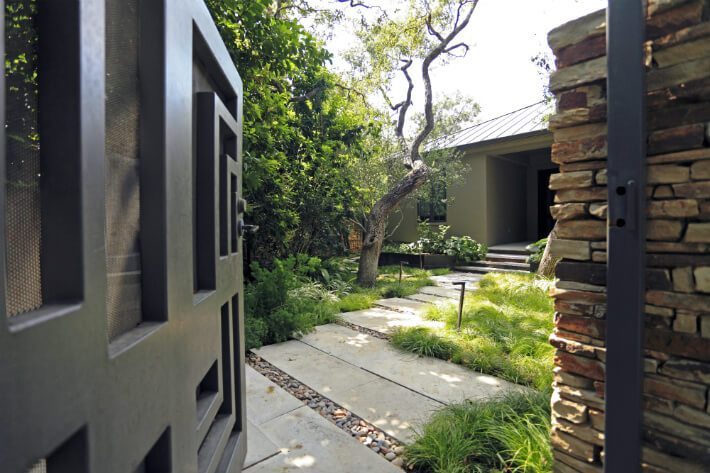 asymmetric stone pathway with brick doorway