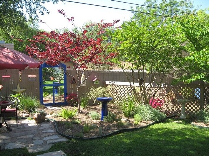 mirror on the garden door, bird bath | SAWS Garden Style Conservation Water Saver San Antonio Texas