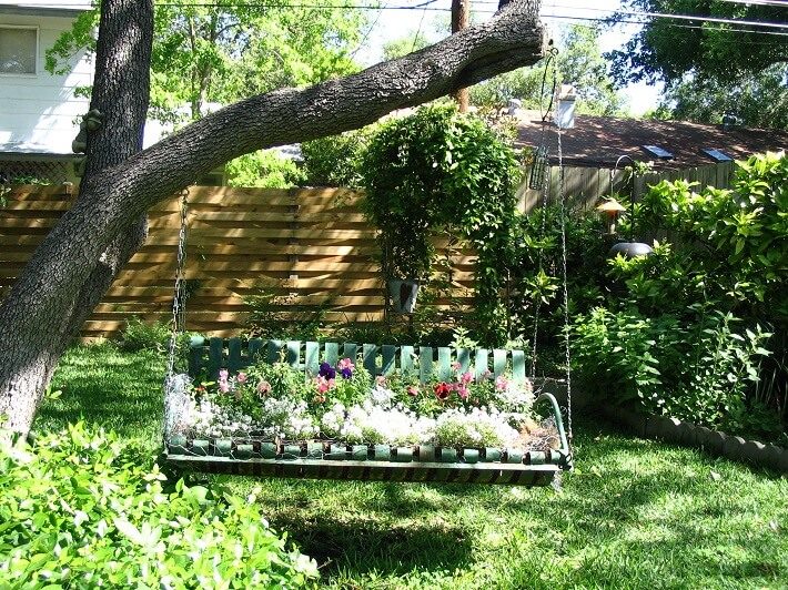 Flower Swing hanging from branches, | SAWS Garden Style Conservation Water Saver San Antonio Texas