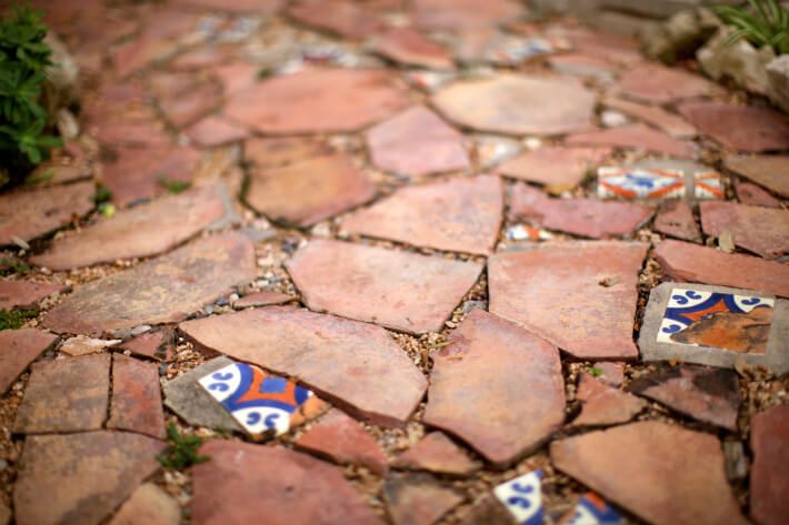 stone pathway with acrylic spanish tile