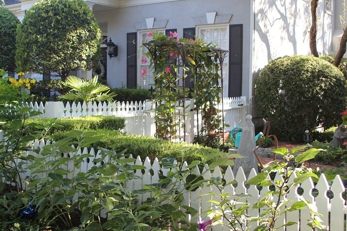 white picket fence with trellis