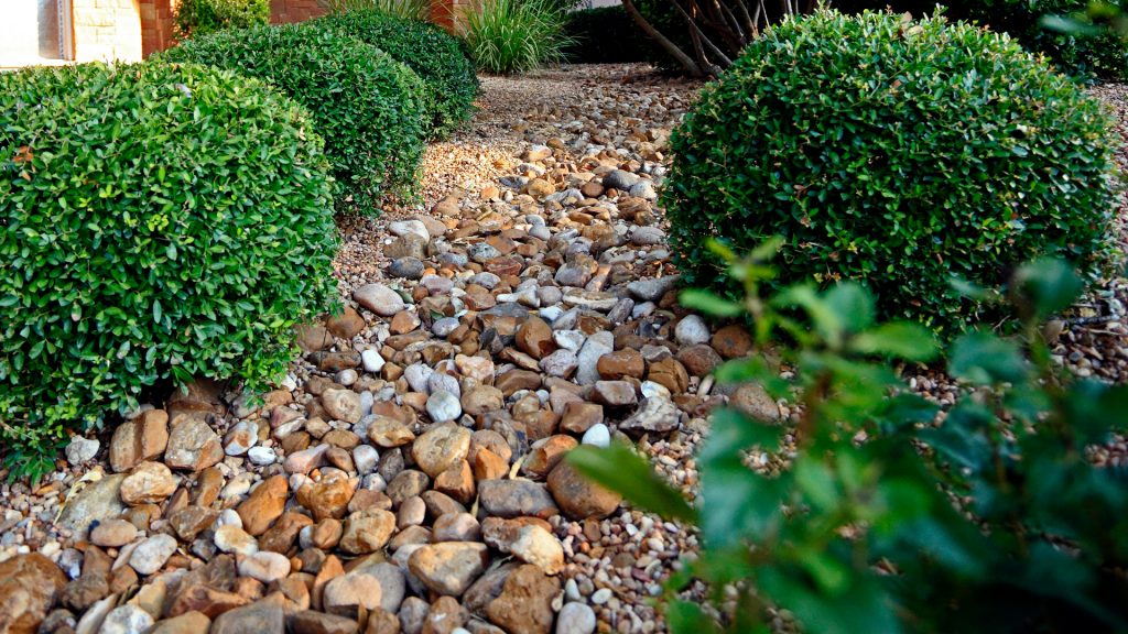 River Rock Garden Style San Antonio, What To Put Under Rocks For Landscaping