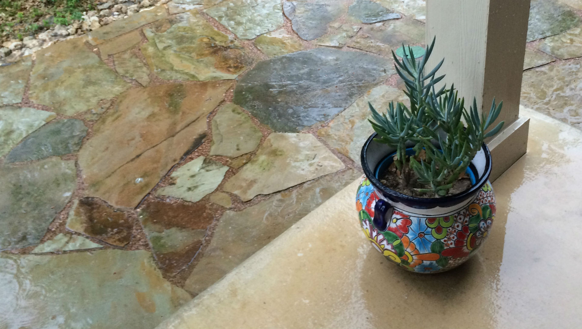 Flagstone set in a gravel base to allow rainwater to permeate into the ground.