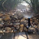 Sprinklerheads wasting water on rocks
