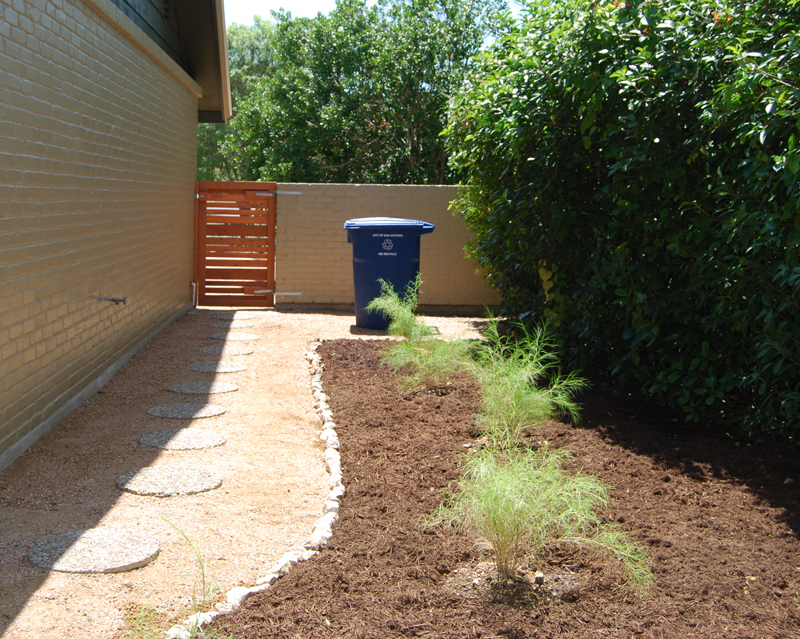 side-yard makeover with stepping stones and muhly