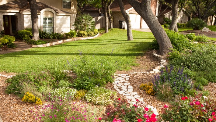 A colorful flower bed with limited lawn makes for a more drought-tolerant landscape.