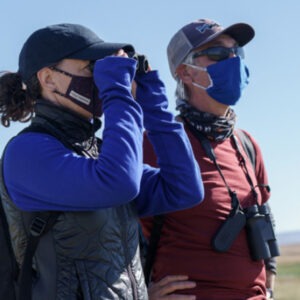 Photo of two people bird watching